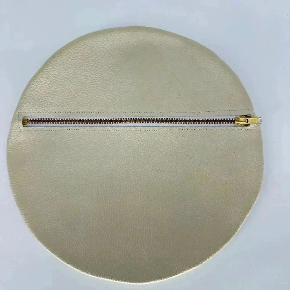 Zippered cream leather Disc clutch purse
